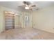 Bedroom with large mirrored closet and ensuite bathroom at 105 Oaks Ct, Sanford, FL 32771