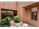 Exterior shot of a brick walkway to a courtyard space with white flowers and views through the house at 105 Oaks Ct, Sanford, FL 32771