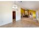 Open concept living room with access to an opening that looks into the living room and fireplace at 105 Oaks Ct, Sanford, FL 32771