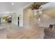 Open concept living room with fireplace, stairs, and an opening looking into the living room at 105 Oaks Ct, Sanford, FL 32771