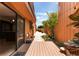 Private outdoor deck with sliding glass door, lush landscaping and pathway at 105 Oaks Ct, Sanford, FL 32771