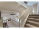 Staircase view down into the living room and views into the backyard through the windows at 105 Oaks Ct, Sanford, FL 32771