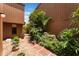Landscaped walkway with brick pavers leading to the front door of the house at 105 Oaks Ct, Sanford, FL 32771
