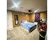 Bedroom with wood paneling and cozy bed at 1181 Partlow Dr, Winter Garden, FL 34787