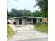 Charming single-story home with concrete driveway and mature trees at 1181 Partlow Dr, Winter Garden, FL 34787