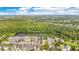Beautiful aerial view of a neighborhood community with a lake and lush green landscaping at 1222 Golden Canna Ln, Celebration, FL 34747