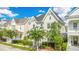 Attractive two-story home with lush greenery and well-maintained lawn at 1222 Golden Canna Ln, Celebration, FL 34747