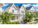Inviting two-story home with manicured lawn and lush trees at 1222 Golden Canna Ln, Celebration, FL 34747