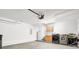 Spacious garage featuring washer, dryer, and shelving at 1222 Golden Canna Ln, Celebration, FL 34747