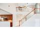 Spacious interior view featuring high ceilings, a ceiling fan, and a staircase with wooden handrails at 1222 Golden Canna Ln, Celebration, FL 34747