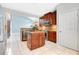Well-appointed kitchen featuring wood cabinets, granite countertops, and stainless steel appliances at 1222 Golden Canna Ln, Celebration, FL 34747