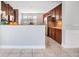 Well-lit kitchen featuring wooden cabinets, granite countertops, and stainless steel appliances at 1222 Golden Canna Ln, Celebration, FL 34747
