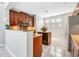 Bright kitchen showcases wood cabinets, granite counters, island with beverage cooler and stainless appliances at 1222 Golden Canna Ln, Celebration, FL 34747