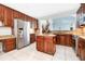 Well-lit kitchen featuring stainless steel appliances, granite countertops, and an island at 1222 Golden Canna Ln, Celebration, FL 34747