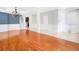 Open-concept living space with hardwood floors, neutral walls, and lots of natural light at 1222 Golden Canna Ln, Celebration, FL 34747