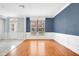 Spacious living room with large windows and hardwood floors at 1222 Golden Canna Ln, Celebration, FL 34747
