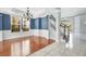 Open living space with hardwood floors, staircase, and bright natural light at 1222 Golden Canna Ln, Celebration, FL 34747