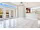 Bright living space with tile floors, windows, and a view of the kitchen at 1222 Golden Canna Ln, Celebration, FL 34747