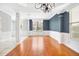 Spacious room with large windows, elegant chandelier, and beautiful hardwood floors at 1222 Golden Canna Ln, Celebration, FL 34747