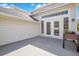 Back patio featuring white trim sliding glass doors and a black planter at 1222 Golden Canna Ln, Celebration, FL 34747