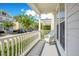 Inviting front porch featuring a comfortable rocking chair with views of a quiet street at 1222 Golden Canna Ln, Celebration, FL 34747