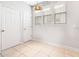 Neutral room with multiple windows and two white doors at 1222 Golden Canna Ln, Celebration, FL 34747