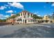 An inviting commercial building with outdoor dining and well-maintained sidewalks at 1222 Golden Canna Ln, Celebration, FL 34747