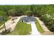 Beautiful single-story home with a manicured lawn and a long driveway leading to an attached two-car garage at 13619 Sw 78Th Place, Dunnellon, FL 34432