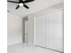 Bedroom featuring a ceiling fan, white marble flooring, and a standard closet at 13619 Sw 78Th Place, Dunnellon, FL 34432