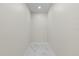 This hallway has sleek marble tile flooring and neutral paint at 13619 Sw 78Th Place, Dunnellon, FL 34432