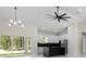 Modern kitchen with stainless steel appliances, marble floors, and an island at 13619 Sw 78Th Place, Dunnellon, FL 34432