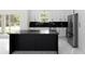 A minimalist kitchen featuring a black island with marble countertops, stainless steel appliances, and white cabinets at 13619 Sw 78Th Place, Dunnellon, FL 34432