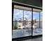Balcony with seating offers views of a modern building and the sky at 14501 Grove Resort Ave # 3737, Winter Garden, FL 34787