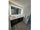 Bathroom with double sink vanity and lots of lighting at 14501 Grove Resort Ave # 3737, Winter Garden, FL 34787