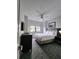 Bright bedroom features neutral tones, a ceiling fan, and a large window offering ample natural light at 14501 Grove Resort Ave # 3737, Winter Garden, FL 34787
