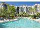 Enjoy the large outdoor pool with palm trees and plenty of lounge chairs at 14501 Grove Resort Ave # 3737, Winter Garden, FL 34787