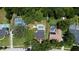 Aerial view of the property showcasing mature trees, the private pool, neighborhood and large lot at 1462 Mt Laurel Dr, Winter Springs, FL 32708