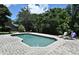 Backyard area with pool and patio area featuring a fire pit and lounge chairs at 1462 Mt Laurel Dr, Winter Springs, FL 32708