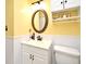 Neat bathroom with round mirror and white wainscoting at 1462 Mt Laurel Dr, Winter Springs, FL 32708