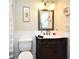 Classic bathroom with beadboard trim, marble vanity, and a framed mirror at 1462 Mt Laurel Dr, Winter Springs, FL 32708