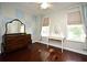 Bright bedroom with decorative accent wall and vintage vanity at 1462 Mt Laurel Dr, Winter Springs, FL 32708