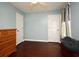 Cozy bedroom featuring light blue walls and dark wood flooring at 1462 Mt Laurel Dr, Winter Springs, FL 32708
