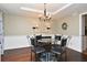 Cozy dining area with an ornate chandelier and seating for five at 1462 Mt Laurel Dr, Winter Springs, FL 32708