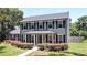 Inviting two-story home with black shutters and a manicured front yard at 1462 Mt Laurel Dr, Winter Springs, FL 32708