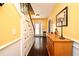 Warm foyer with hardwood floors, staircase, and decorative accents at 1462 Mt Laurel Dr, Winter Springs, FL 32708