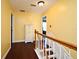 Bright hallway with hardwood floors and white trim, leading to various rooms in the house at 1462 Mt Laurel Dr, Winter Springs, FL 32708