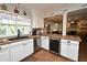 Bright kitchen featuring stainless steel appliances, breakfast bar, and stylish cabinetry at 1462 Mt Laurel Dr, Winter Springs, FL 32708
