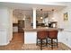 Open concept kitchen with breakfast bar, stainless appliances, and custom cabinets at 1462 Mt Laurel Dr, Winter Springs, FL 32708