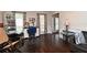 A cozy living room area, featuring hardwood floors, a view of the entrance and plenty of sunlight at 1462 Mt Laurel Dr, Winter Springs, FL 32708