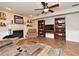 The living room featuring a cozy fireplace, custom bookshelves, and comfortable seating on tile floors at 1462 Mt Laurel Dr, Winter Springs, FL 32708